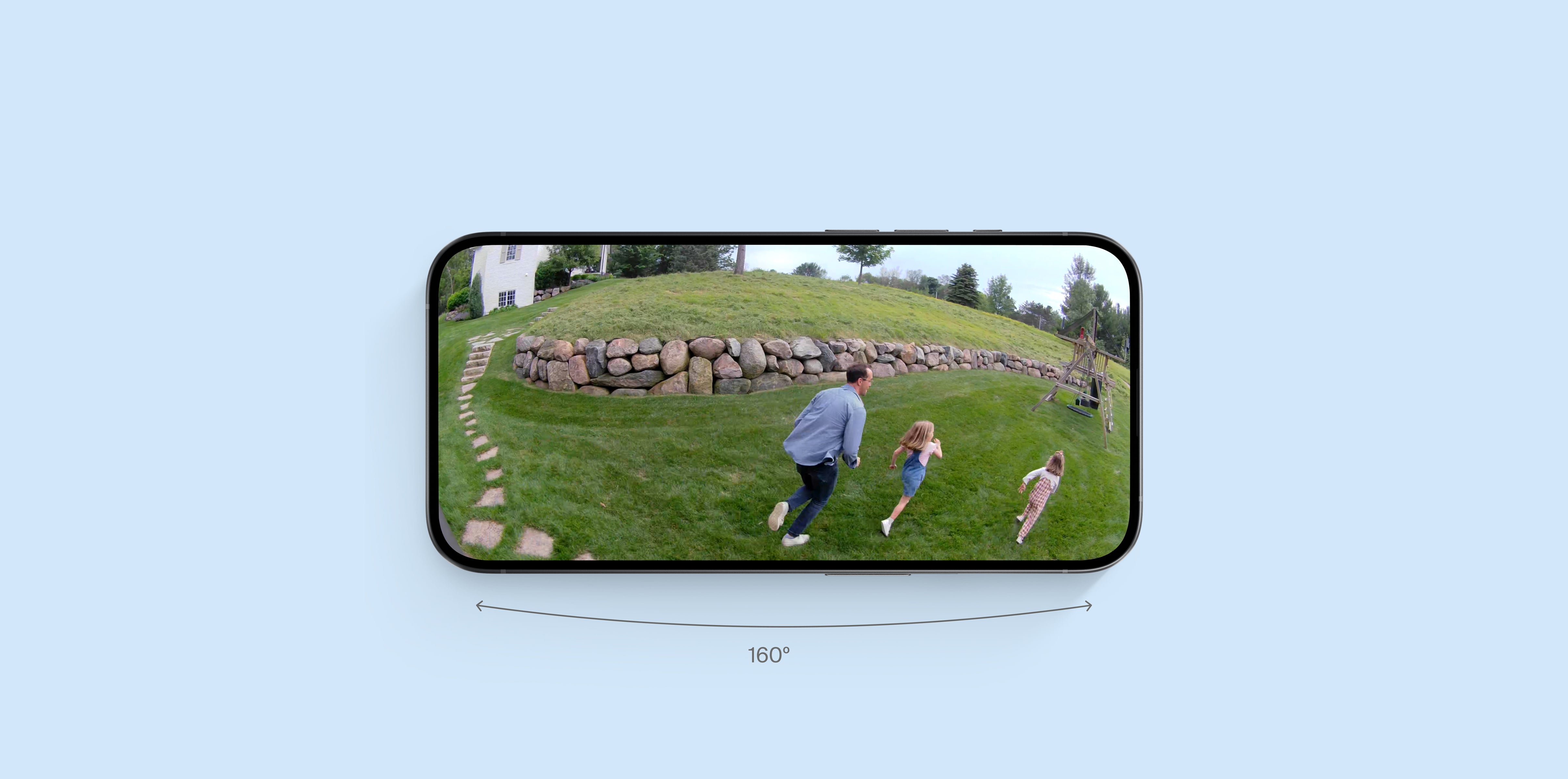 A family playing in a backyard with 160 degree field of view on a phone